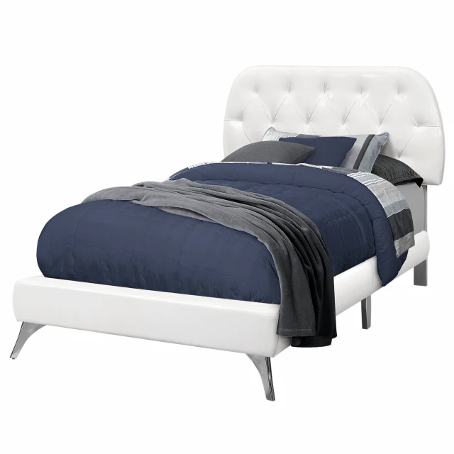 Twin tufted white upholstered linen bed in a stylish bedroom setting