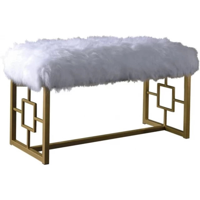 White gold upholstered faux fur bench in a snowy outdoor setting