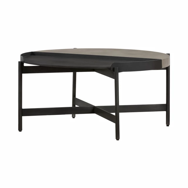 Black concrete metal round coffee table in an outdoor setting