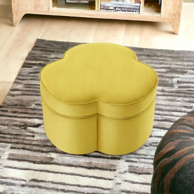 Yellow velvet specialty cocktail ottoman with wood rectangle base and beige flooring