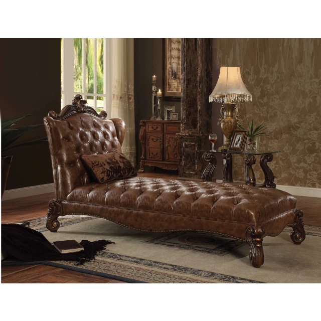 Light brown wood chaise with pillow in a cozy interior design setting