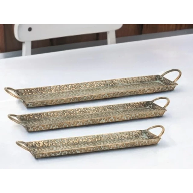 gold metal tray handles on wooden table
