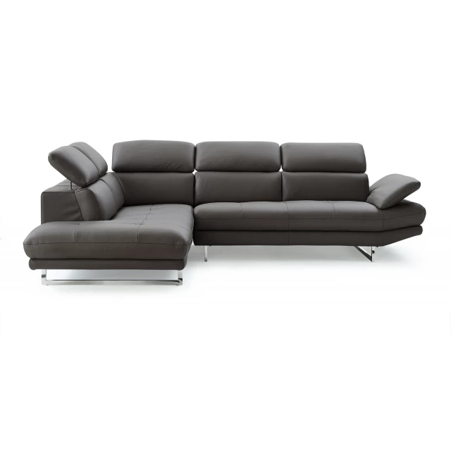 Leather L-shaped sofa chaise sectional in a comfortable studio setting with wooden flooring