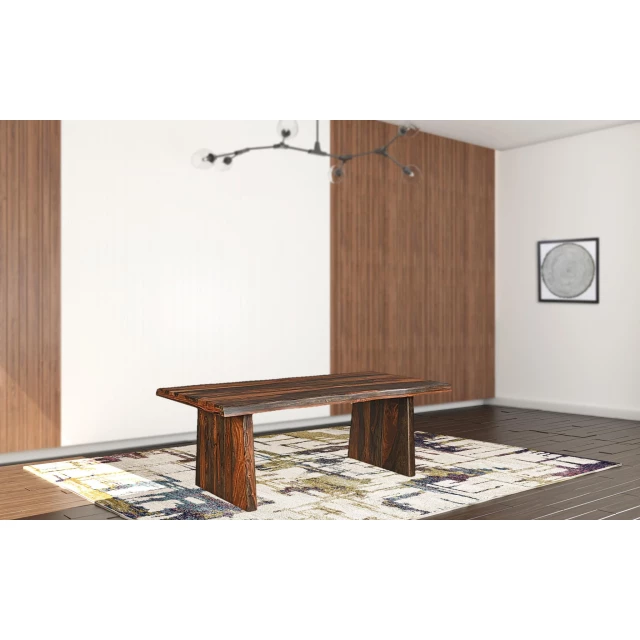Dark brown solid wood dining table in interior design setting with wood flooring