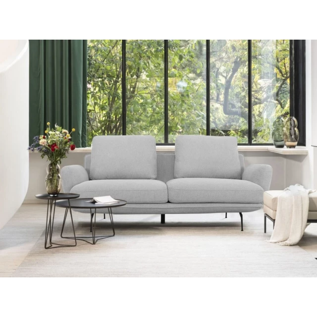 Contempo retro light gray loveseat with comfortable cushions by a window in a cozy room setting