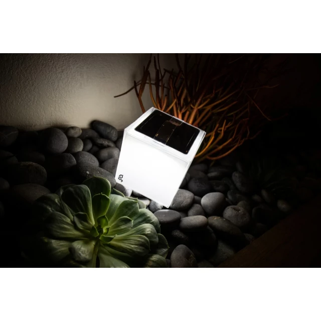 modern square portable hangable solar lantern with wood and grass background
