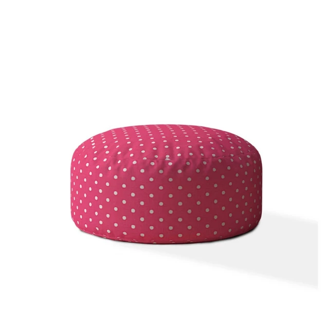 Cotton round polka dots pouf cover in a styled setting with table and patterned decor items