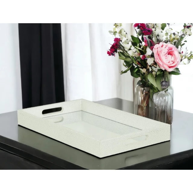 silver rectangular wood handmade tray with handles and flowers on a table
