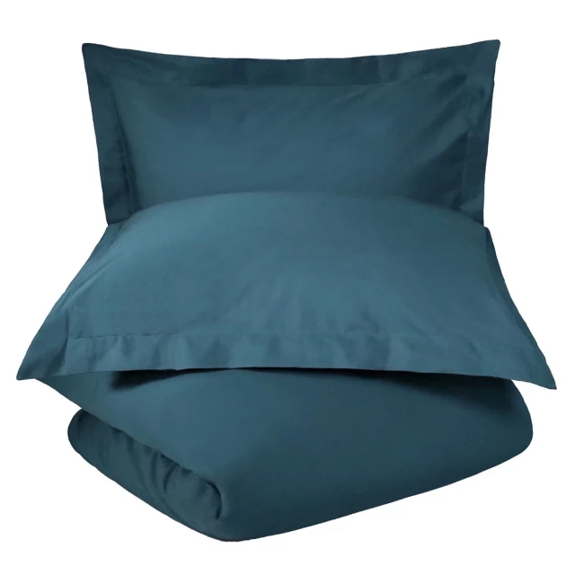Cotton thread count washable duvet cover with comfortable pillows and linens on a wood chair