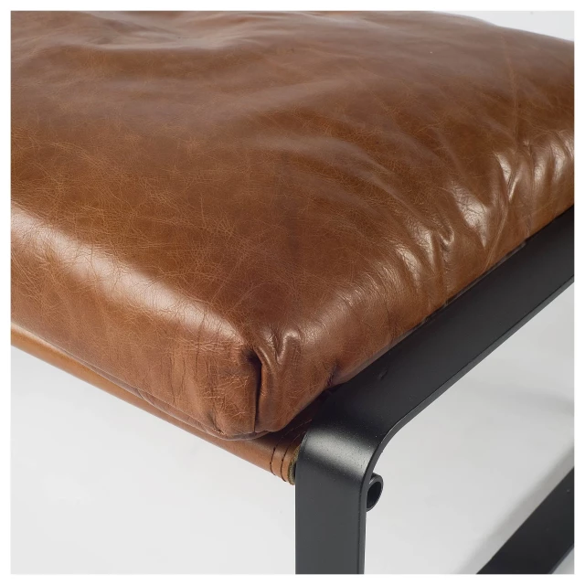 Brown faux leather ottoman in rectangle shape with natural and composite materials for comfort and style