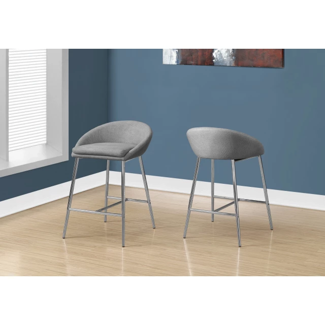 Silver metal low back bar chairs with window blinds and wooden floor in background