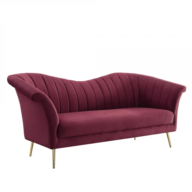 Red gold velvet sofa with comfortable magenta studio couch design and wooden elements