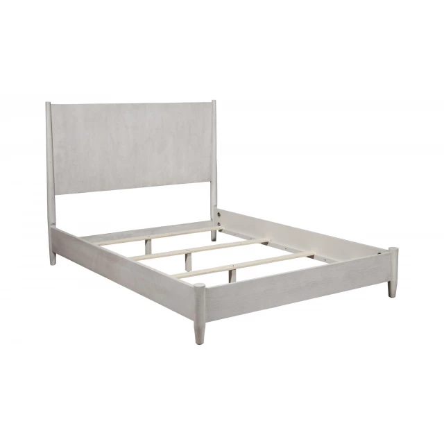 Solid manufactured wood California king bed in elegant bedroom setting
