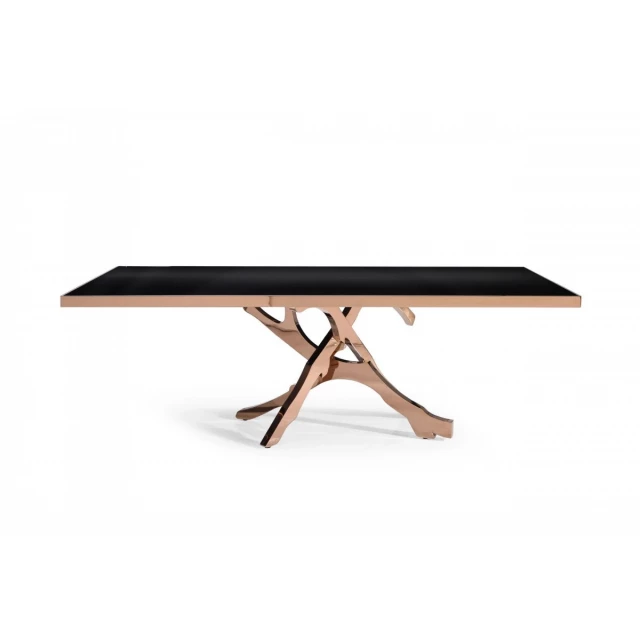 Rosegold abstract pedestal base dining table in a modern outdoor setting with wood accents
