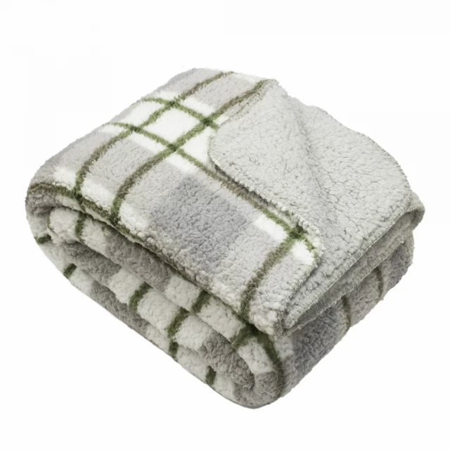 White printed sherpa throw blanket on grass