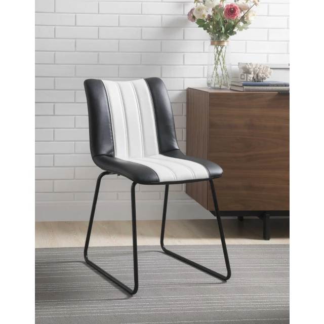 Black white leatherette accent chair in modern interior design with wood elements