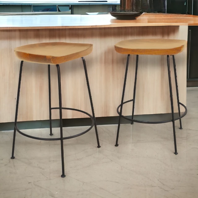 Steel backless counter height bar chairs with wood flooring