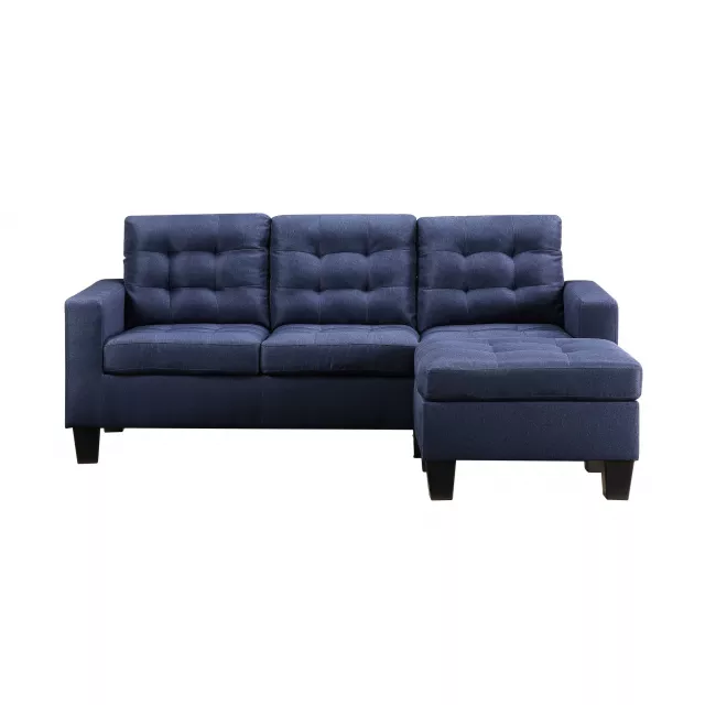 Blue linen fabric sofa with armrests and wooden accents in a comfortable studio setting