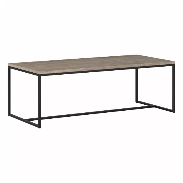 Gray coffee table with hardwood and metal materials in an outdoor setting