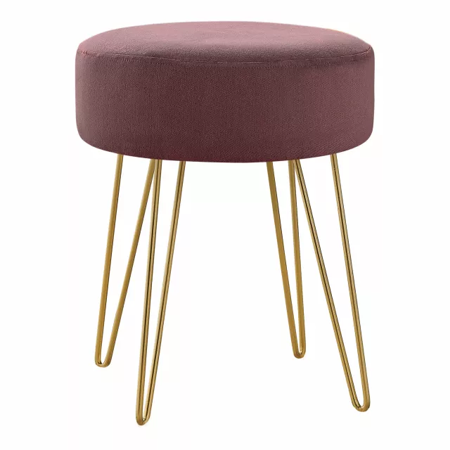 Plum velvet gold round ottoman with luxurious tints and wood accents in fashion accessory style