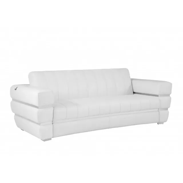 White silver Italian leather sofa with comfortable cushions and wooden frame in a studio setting