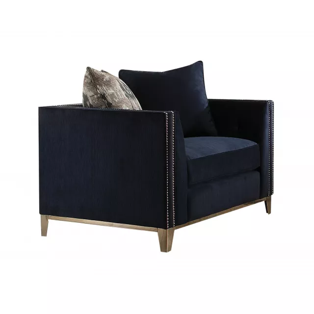 Black tufted arm chair with wood and metal accents suitable for outdoor furniture