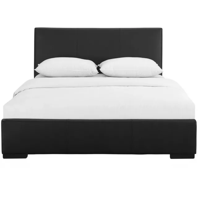 Black upholstered king platform bed in a bedroom setting