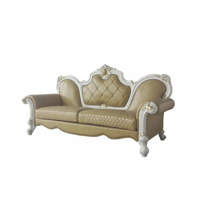 Leather pearl sofa with five toss pillows and wood accents in a comfortable studio setting