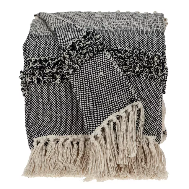 Black handloom weave throw with decorative tassels featuring art pattern and resembling a pillow
