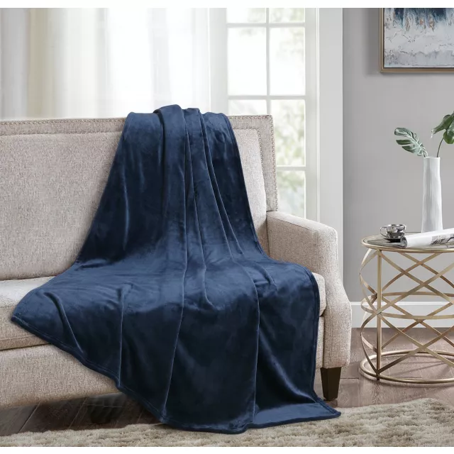 Blue solid anti microbial oversized throw in azure color with comfort and textile elements in interior design setting