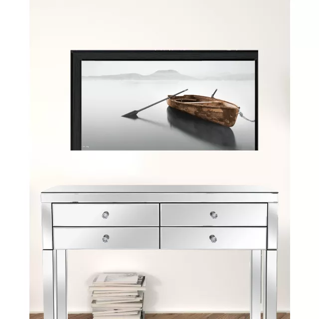 Reflections black framed print wall art on a chest of drawers in a stylish room