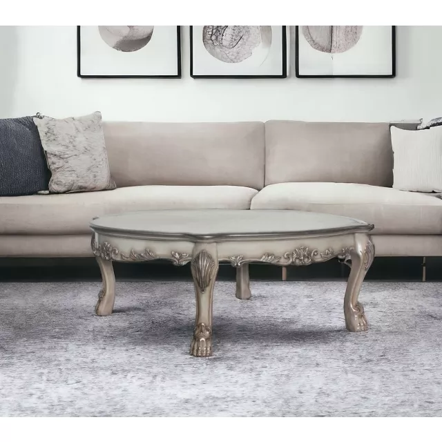 Bone solid manufactured wood coffee table with brown rectangle top and black legs in an interior design setting