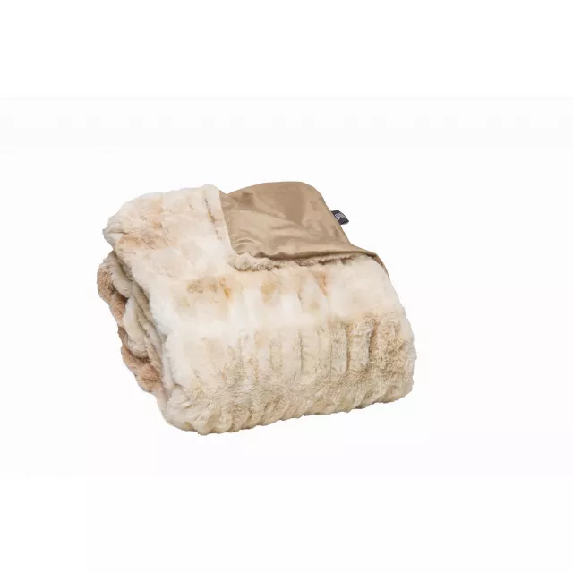 Beige faux fur throw blanket made of natural material on a wooden bed