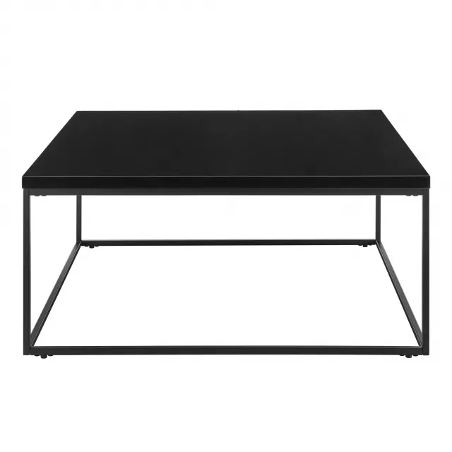 Black high gloss square coffee table with symmetrical design and artful balance