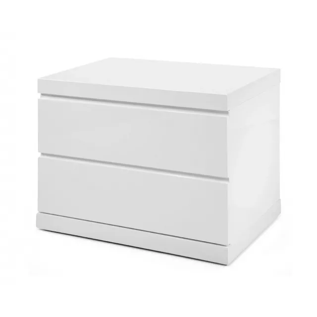 White drawers nightstand with metal handles and plant decor