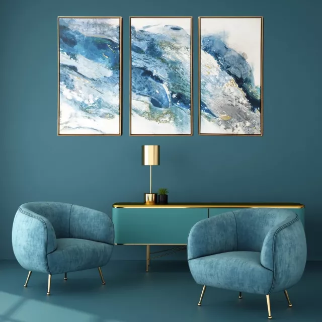 Blue and gold framed canvas wall art in a stylish interior setting