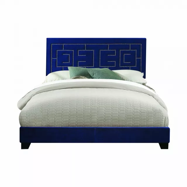 Standard bed with upholstered nailhead trim headboard in elegant bedroom decor