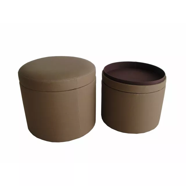 Tan faux leather round storage ottoman with metal and plastic accents