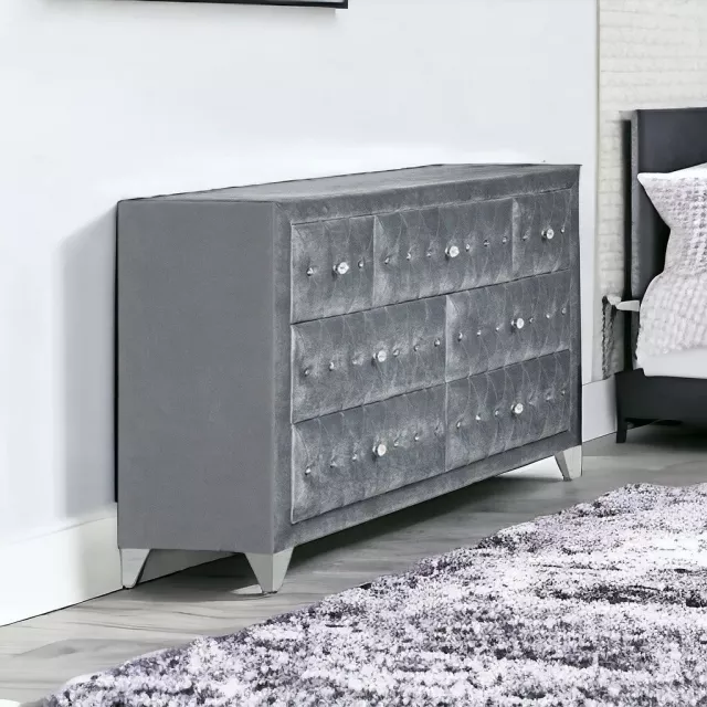Manufactured wood seven drawer triple dresser in a clean design