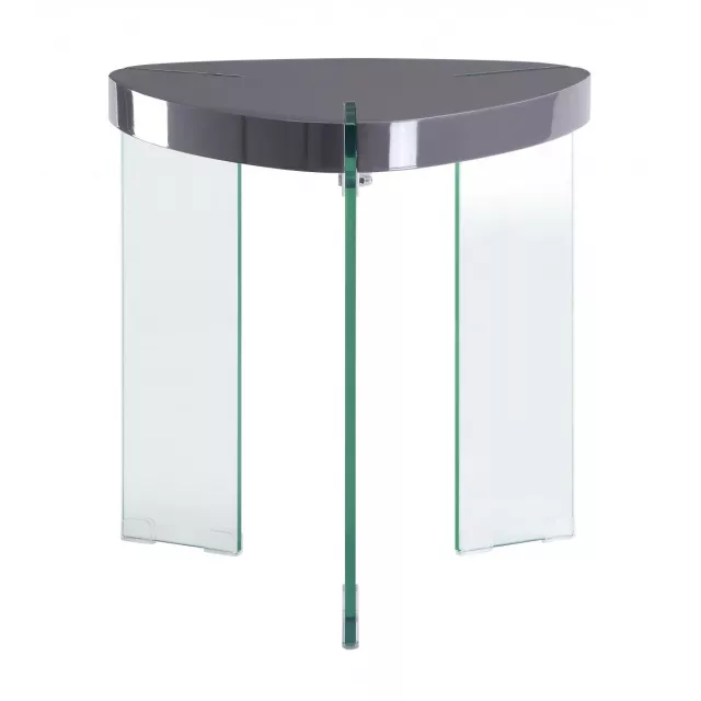 Triangular manufactured wood and glass end table in a modern furniture setting