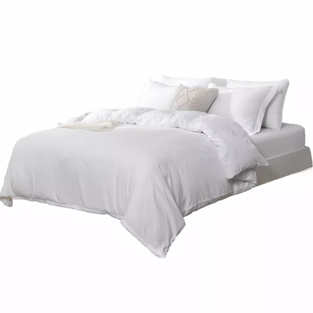 High thread count machine washable duvet cover on sofa with pillows and wood accents