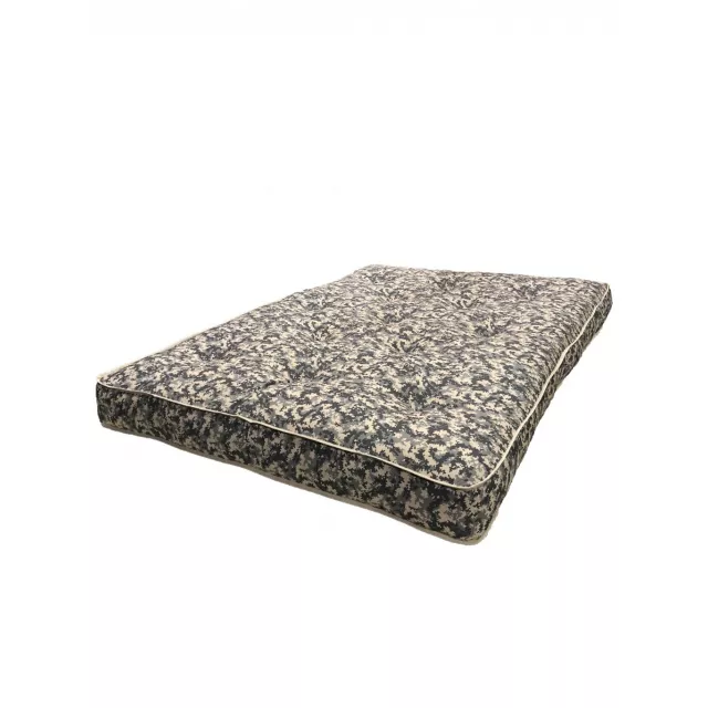 Camo double foam full mattress with patterned linens on textured flooring