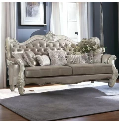 Leather bone sofa with seven toss pillows in a cozy room setup with wood accents
