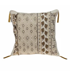 Gold bronze embroidered decorative throw pillow on beige couch