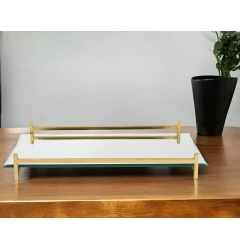 mirror gold rectangular glass vanity tray on wooden table with plant and flowerpot