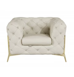 Glam beige gold tufted leather armchair with comfortable armrests perfect for elegant home decor