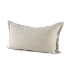 Beige cream bordered lumbar pillow cover on couch with throw pillow accessories