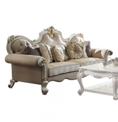 Beige fabric velvet pearl sofa toss pillows on a wooden studio couch for comfortable indoor furnishing