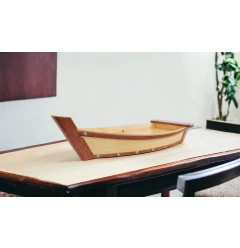 brown wood sushi boat serving tray made of hardwood with varnish