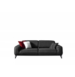 Dark gray linen sleeper sofa with pillows in a comfortable studio couch setup